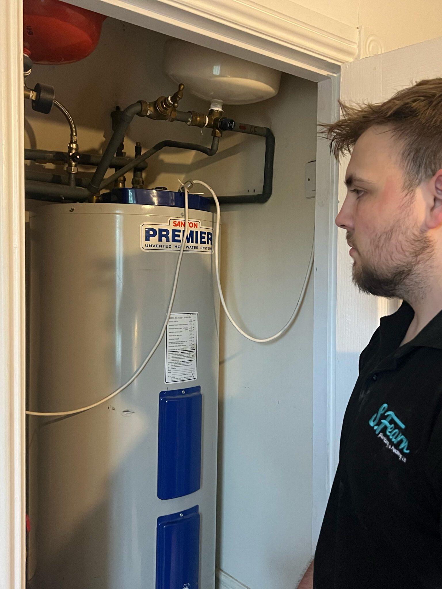 Callum the Gas Engineer in leeds replacing a tank